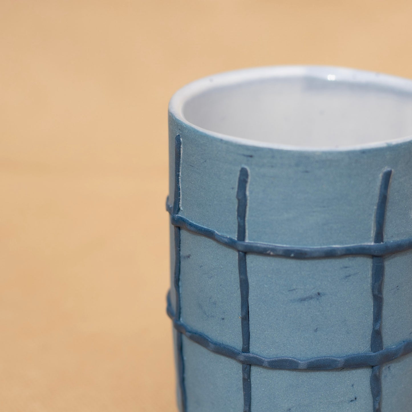 Close up of a handmade blue cup