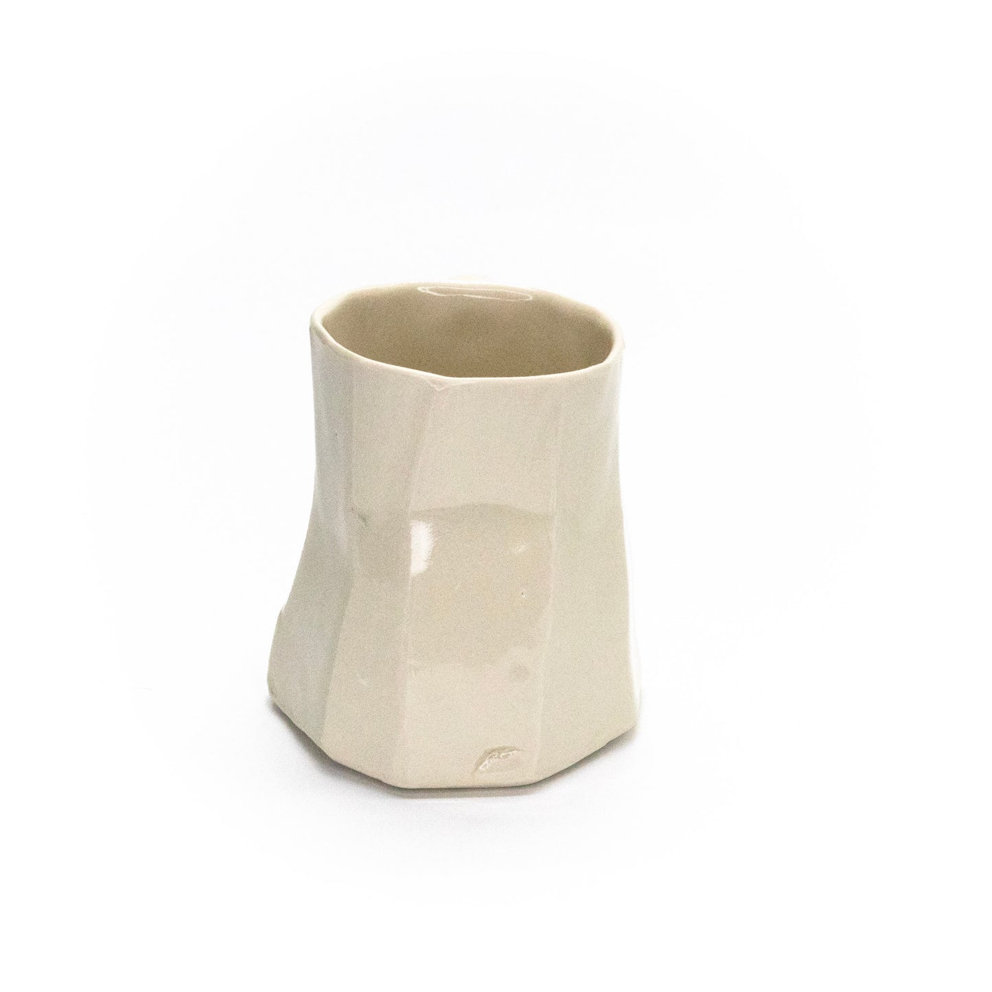 Small white facet mug by Frank Fabens