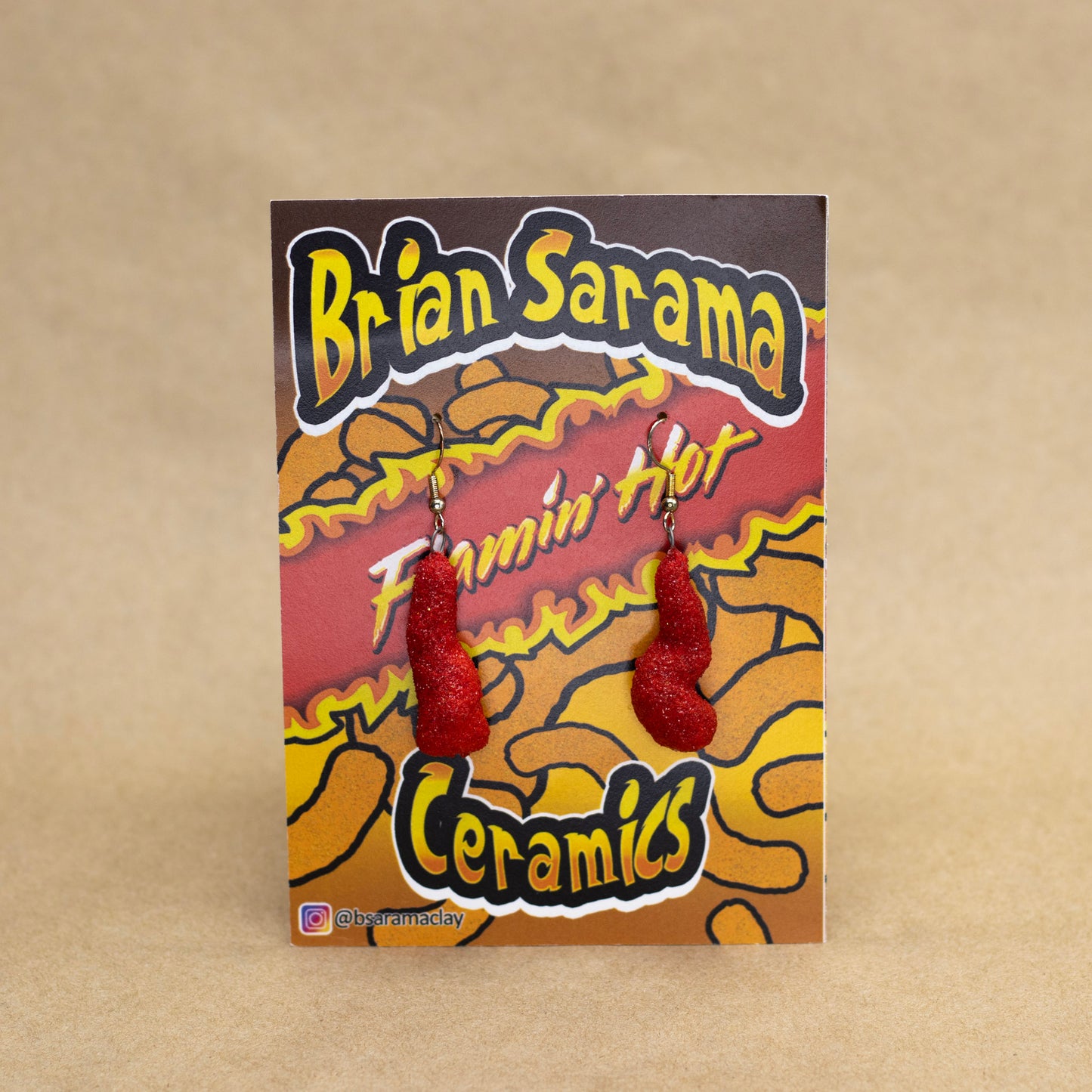 Cheeto Earrings by Brian Sarama