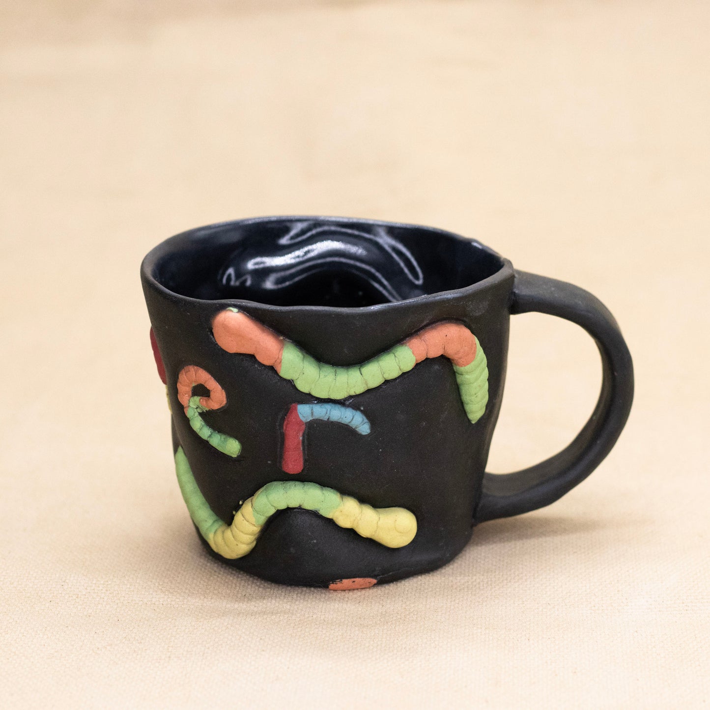 Queer Gummy Worm Mug by Amber Frances