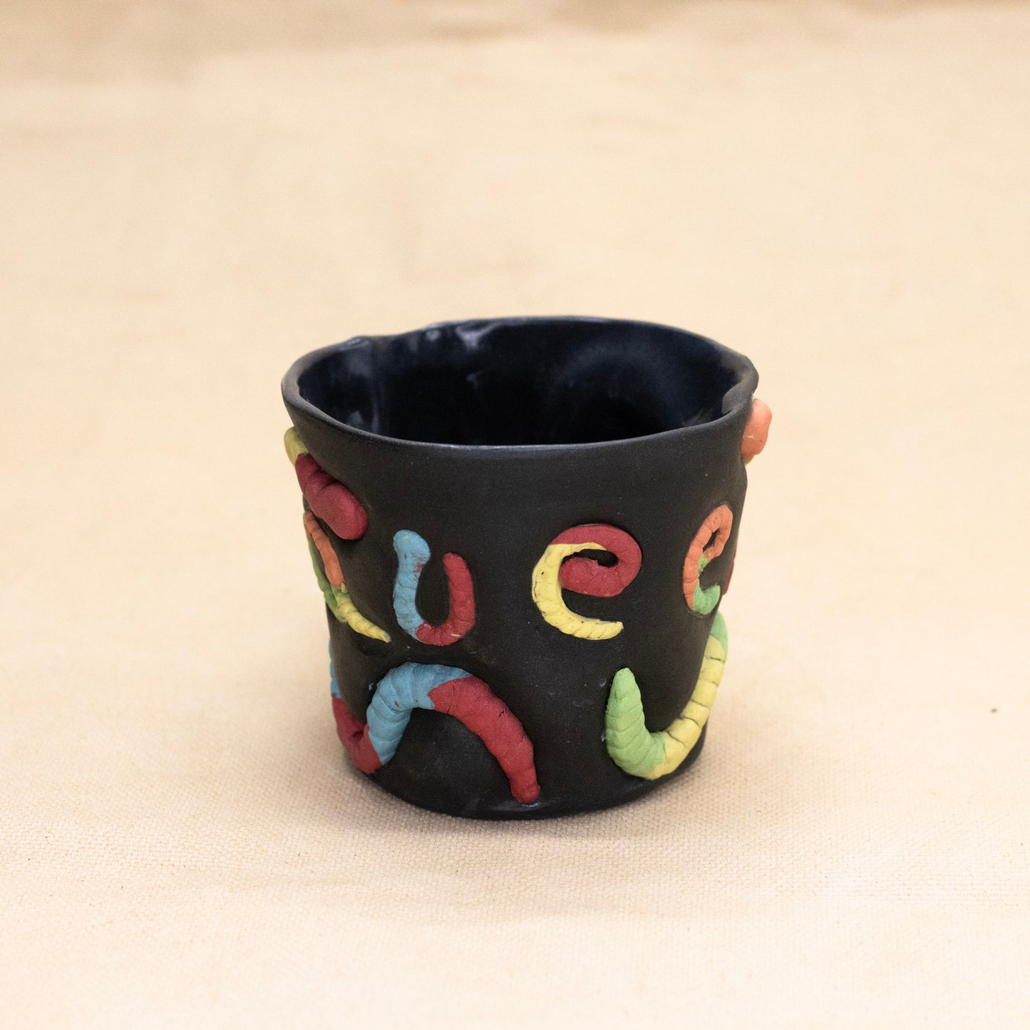 Queer Gummy Worm Mug by Amber Frances