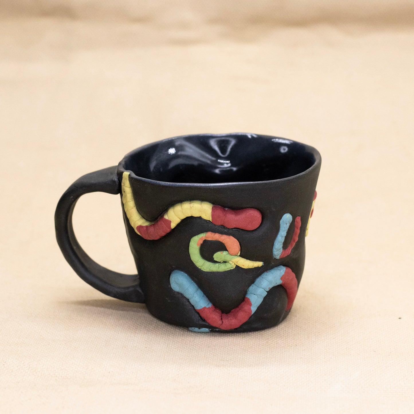 Queer Gummy Worm Mug by Amber Frances