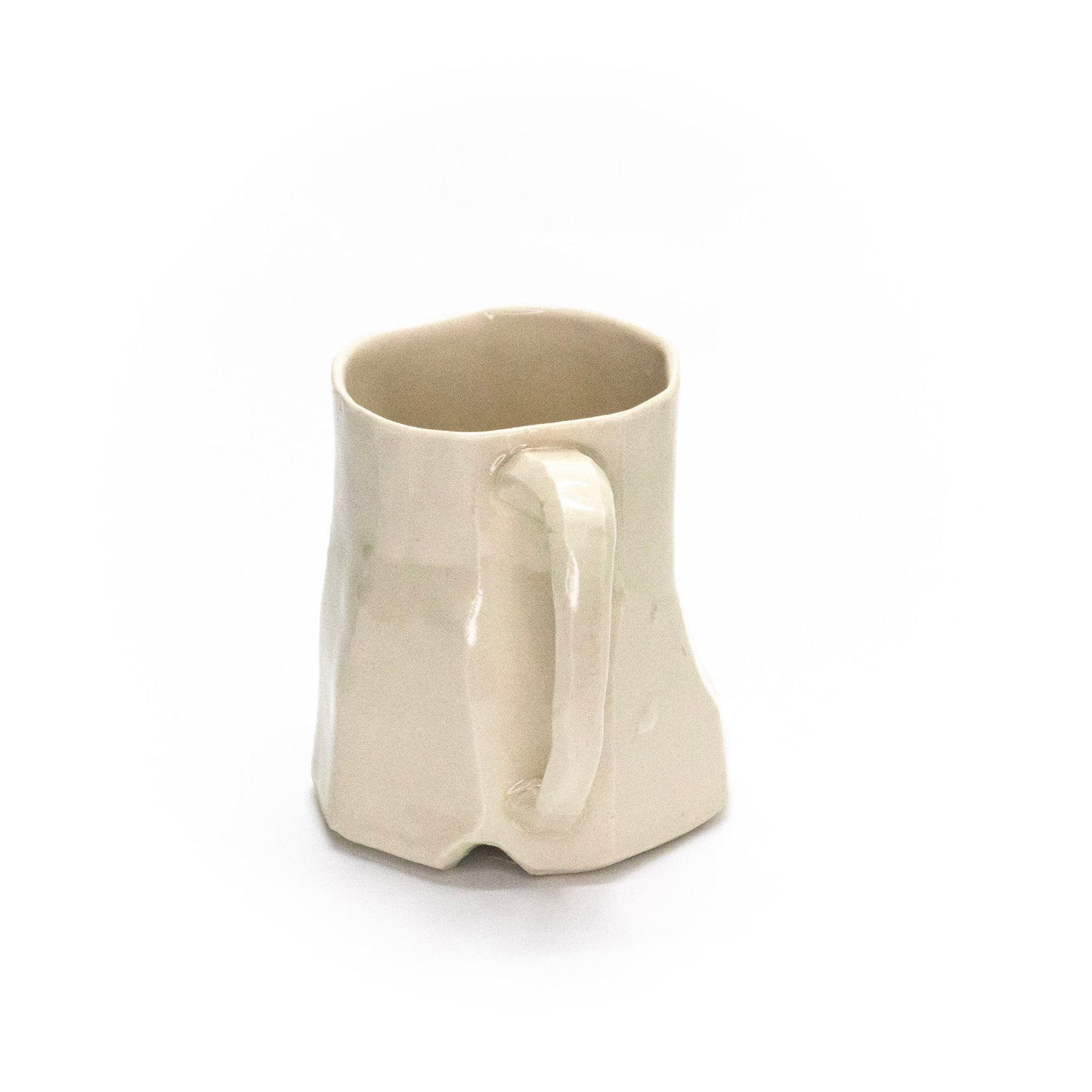 Small white facet mug by Frank Fabens