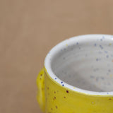 Trapped! Café Cup in Yellow by Jennifer Mayer